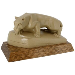 stone colored Nittany Lion Shrine on oak base